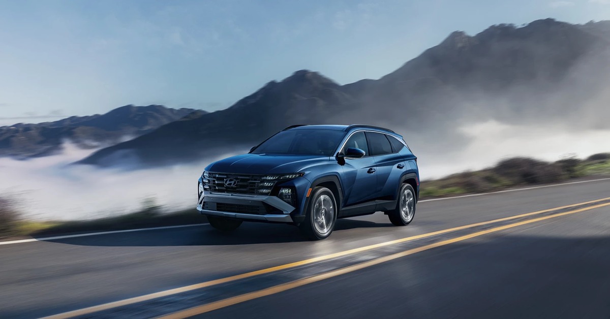Hyundai Tucson driving on a scenic road
